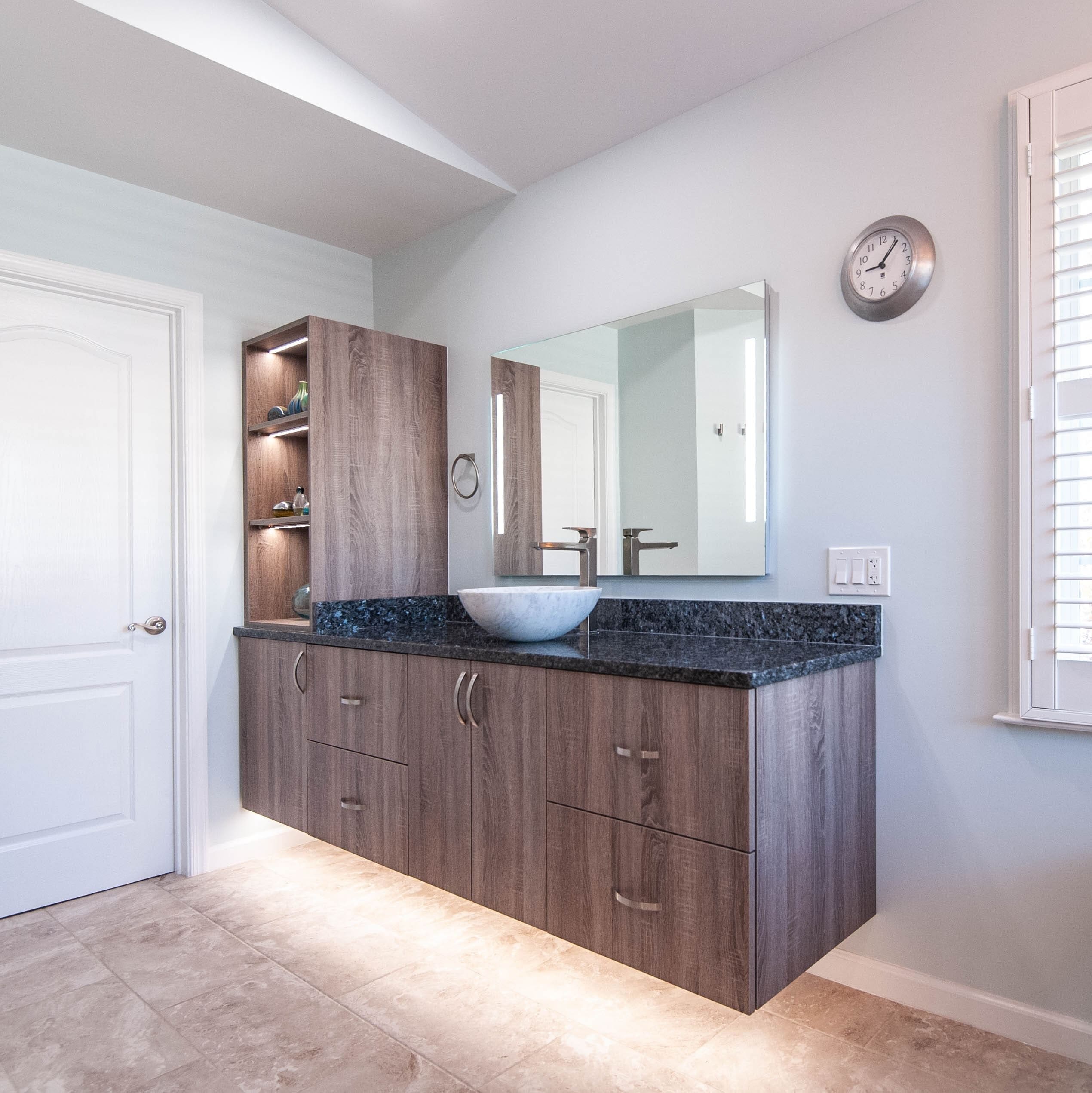 A picture of a primary bathroom remodel done by Select Kitchen & Bath. Showing the vanity and countertop.